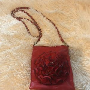 Red Purse with red flower and Red & silver chain.
